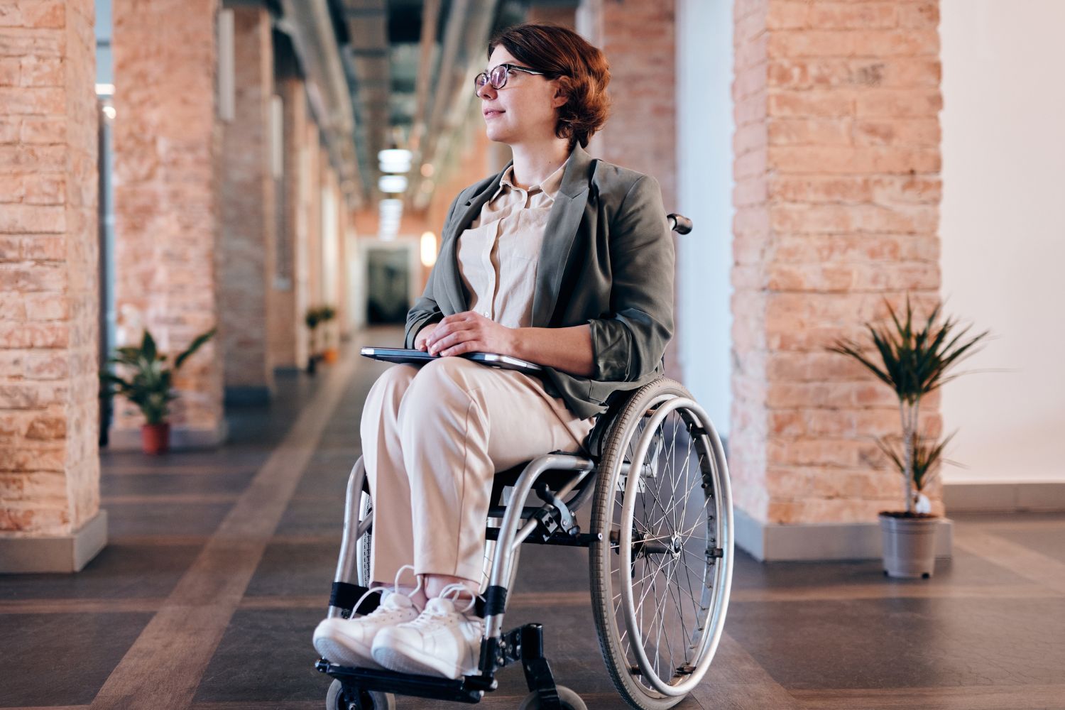 person in wheelchair in business attire