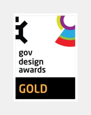 A Gov Design Awards certificate with a colorful geometric design and the word "GOLD" in bold yellow text at the bottom.