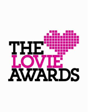 The Lovie Awards logo with a pixelated pink heart above the text “The Lovie Awards” in black and pink on a white background.