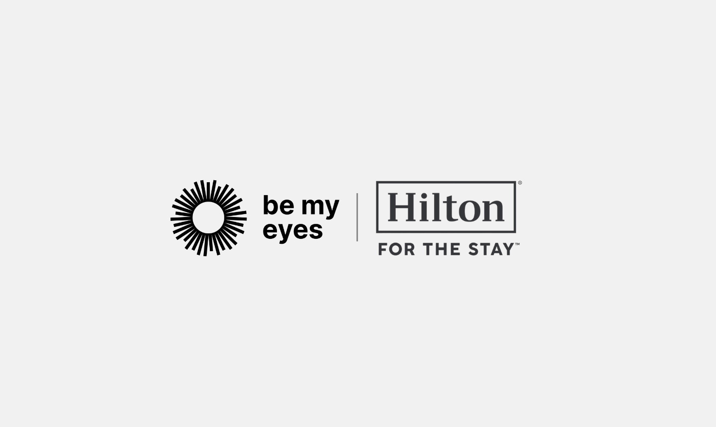 Logos of "Be My Eyes" on the left and "Hilton For the Stay" on the right appear side by side against a light gray background.