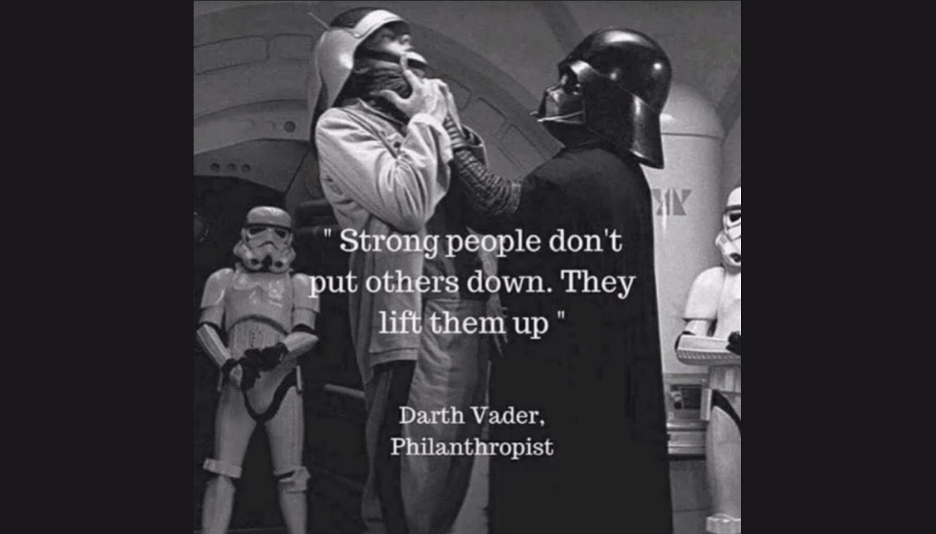 Darth Vader lifts an officer by the neck, with stormtroopers watching. Caption reads: "Strong people don't put others down. They lift them up—like a true force of compassion.